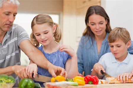 simsearch:400-05749624,k - Lovely family cooking together at home Stock Photo - Budget Royalty-Free & Subscription, Code: 400-05749569