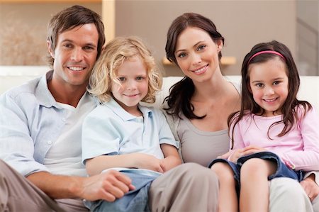 simsearch:400-05749624,k - Happy family watching television together in a living room Stock Photo - Budget Royalty-Free & Subscription, Code: 400-05749656