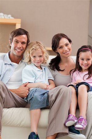 simsearch:400-05749624,k - Portrait of a family watching television together in a living room Stock Photo - Budget Royalty-Free & Subscription, Code: 400-05749658