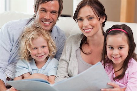 simsearch:632-08227559,k - Close up of a family looking at a photo album in a living room Stock Photo - Budget Royalty-Free & Subscription, Code: 400-05749682