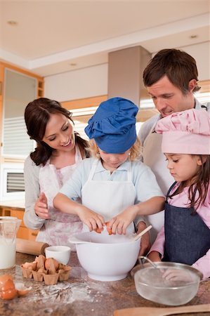 Portrait of a family baking in a kitchen Stock Photo - Budget Royalty-Free & Subscription, Code: 400-05749759