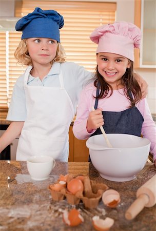 Portrait of siblings baking together in a kitchen Stock Photo - Budget Royalty-Free & Subscription, Code: 400-05749765