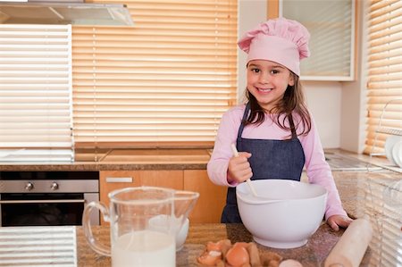 simsearch:400-05749768,k - Cute girl baking in her kitchen Stock Photo - Budget Royalty-Free & Subscription, Code: 400-05749762