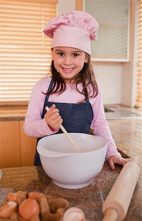 simsearch:400-06078465,k - Portrait of a girl baking in a kitchen Stock Photo - Budget Royalty-Free & Subscription, Code: 400-05749763