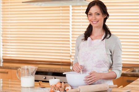 Beautiful woman baking in her kitchen Stock Photo - Budget Royalty-Free & Subscription, Code: 400-05749771