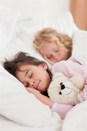 Portrait of siblings sleeping in a bedroom Stock Photo - Budget Royalty-Free & Subscription, Code: 400-05749820