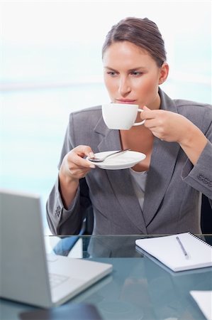 simsearch:400-08554629,k - Portrait of a serious businesswoman drinking coffee in her office Fotografie stock - Microstock e Abbonamento, Codice: 400-05740233