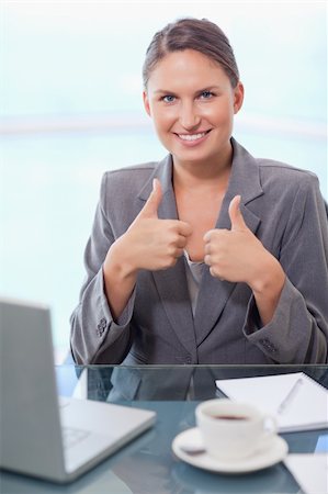 Portrait of a businesswoman with the thumbs up in her office Stock Photo - Budget Royalty-Free & Subscription, Code: 400-05740254