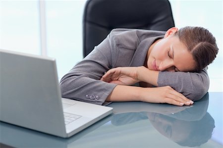 simsearch:400-04188055,k - Young businesswoman sleeping in her office Stockbilder - Microstock & Abonnement, Bildnummer: 400-05740268