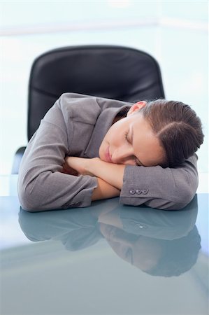 Portrait of a tired businesswoman sleeping on her desk Stock Photo - Budget Royalty-Free & Subscription, Code: 400-05740275