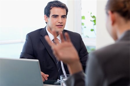 simsearch:400-04187120,k - Handsome manager interviewing a female applicant in his office Stock Photo - Budget Royalty-Free & Subscription, Code: 400-05740315