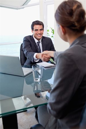 employees shaking hands - Portrait of a manager interviewing a female applicant in his office Stock Photo - Budget Royalty-Free & Subscription, Code: 400-05740311