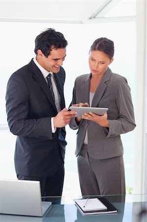 sales person with a tablet - Young business partner looking at tablet together Stock Photo - Budget Royalty-Free & Subscription, Code: 400-05740329