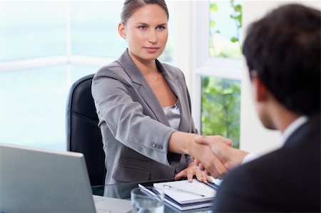 simsearch:400-04187120,k - Young businesswoman shaking hands with customer Stock Photo - Budget Royalty-Free & Subscription, Code: 400-05740320