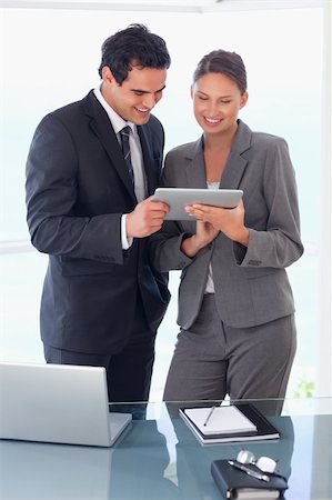 sales person with a tablet - Young trades partner looking at tablet in their hands Stock Photo - Budget Royalty-Free & Subscription, Code: 400-05740334