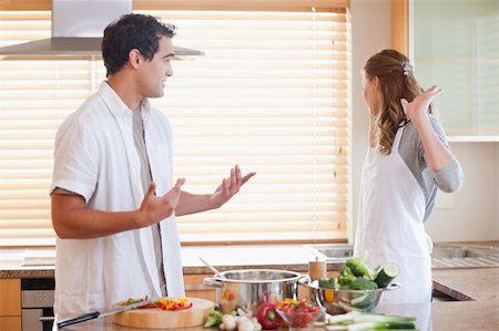 Young couple has a tensed situation in the kitchen Stock Photo - Budget Royalty-Free & Subscription, Code: 400-05740995