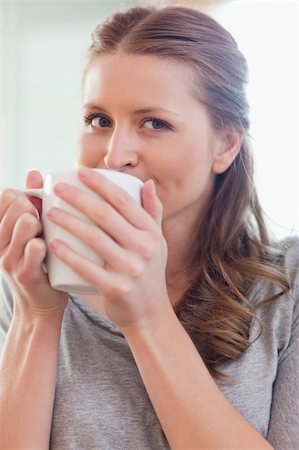 simsearch:400-05749531,k - Close up of young woman enjoying coffee Stock Photo - Budget Royalty-Free & Subscription, Code: 400-05741118