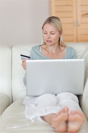 simsearch:6109-06195018,k - Young woman entering her credit card information Stock Photo - Budget Royalty-Free & Subscription, Code: 400-05741357