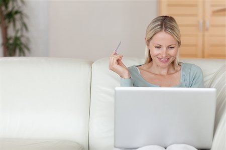 simsearch:6109-06195018,k - Young woman shopping online on the sofa Stock Photo - Budget Royalty-Free & Subscription, Code: 400-05741365