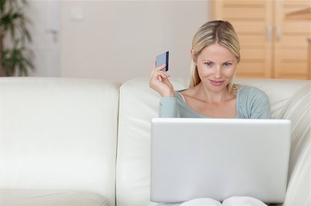 simsearch:6109-06195018,k - Young woman on the sofa booking holidays online Stock Photo - Budget Royalty-Free & Subscription, Code: 400-05741366