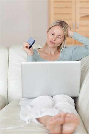 simsearch:6109-06195018,k - Young woman on the sofa shopping online Stock Photo - Budget Royalty-Free & Subscription, Code: 400-05741360