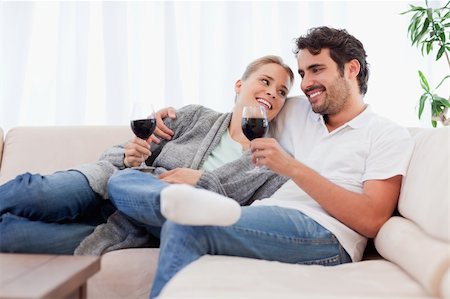 simsearch:400-04663577,k - Couple drinking a glass of  red wine in their living room Stock Photo - Budget Royalty-Free & Subscription, Code: 400-05741798