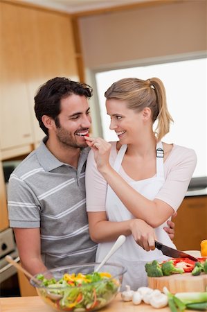 simsearch:400-04162443,k - Portrait of a lovely couple cooking in their kitchen Fotografie stock - Microstock e Abbonamento, Codice: 400-05741828