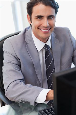 simsearch:400-05900668,k - Portrait of a businessman working with a computer in his office Stock Photo - Budget Royalty-Free & Subscription, Code: 400-05741925