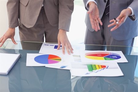 Hands of business people working on statistics in a meeting room Stock Photo - Budget Royalty-Free & Subscription, Code: 400-05741996