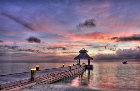 Awsome vivid sunset over the jetty in the Indian ocean, Maldives. HDR Foto de stock - Super Valor sin royalties y Suscripción, Código: 400-05742452