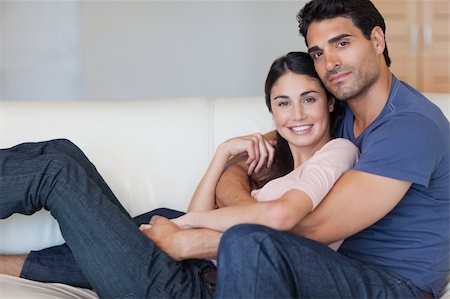 simsearch:400-04151970,k - Lovely young couple posing in their living room Fotografie stock - Microstock e Abbonamento, Codice: 400-05742617