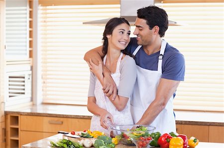 simsearch:400-04162443,k - Lovely young couple posing in their kitchen Fotografie stock - Microstock e Abbonamento, Codice: 400-05742624