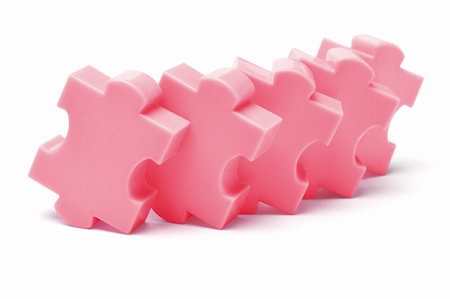 plastic blocks - Row of plastic jigsaw puzzles arranged on white background Stock Photo - Budget Royalty-Free & Subscription, Code: 400-05742658