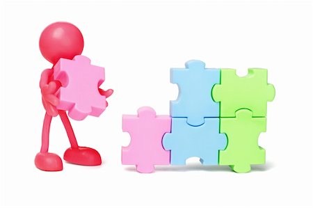 people holding puzzle pieces - Red faceless figurine working on jigsaw puzzles Stock Photo - Budget Royalty-Free & Subscription, Code: 400-05742664