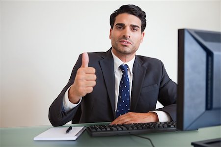 simsearch:400-05718341,k - Businessman with the thumb up in his office Stock Photo - Budget Royalty-Free & Subscription, Code: 400-05742731