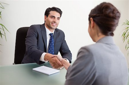 simsearch:400-05022667,k - Smiling manager interviewing a female applicant in his office Stockbilder - Microstock & Abonnement, Bildnummer: 400-05742776