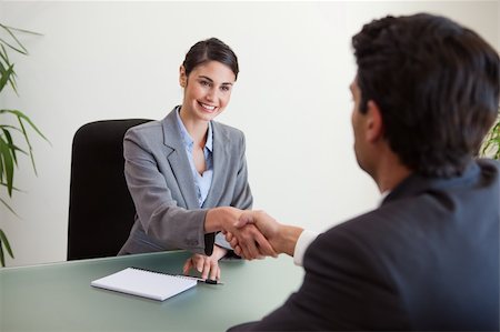 simsearch:400-05034438,k - Manager shaking the hand of a customer in her office Stock Photo - Budget Royalty-Free & Subscription, Code: 400-05742781