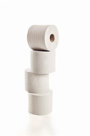Rolls of toilet paper arranged on white background Fotografie stock - Microstock e Abbonamento, Codice: 400-05742848
