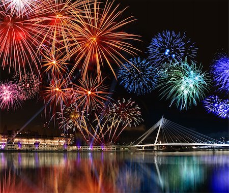 Colorful fireworks reflect from water,  beautiful bridge scenery Stock Photo - Budget Royalty-Free & Subscription, Code: 400-05754341