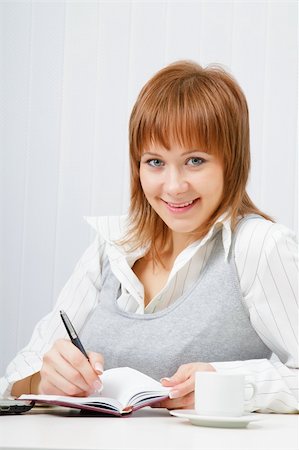 simsearch:400-05732500,k - smiling attractive girl with a notebook. Office worker Foto de stock - Royalty-Free Super Valor e Assinatura, Número: 400-05754715