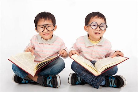 simsearch:400-04131892,k - Happy kids with big book wearing black glasses Stockbilder - Microstock & Abonnement, Bildnummer: 400-05754838
