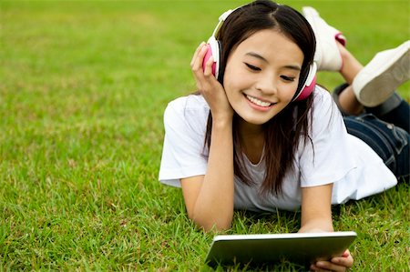 students tablets outside - happy girl using tablet pc on the grass Stock Photo - Budget Royalty-Free & Subscription, Code: 400-05754839