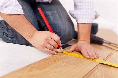 Home improvment - laying laminate flooring, measuring Stock Photo - Budget Royalty-Free & Subscription, Code: 400-05755127