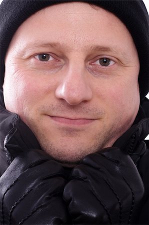 photohomepage (artist) - A smiling man with bobble cap and leather gloves Photographie de stock - Aubaine LD & Abonnement, Code: 400-05755505