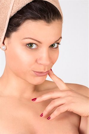 Beautiful young woman with a towel on her head. Over white. Not isolated. Stock Photo - Budget Royalty-Free & Subscription, Code: 400-05755502