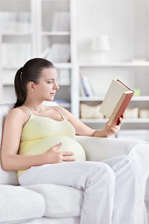 A pregnant young woman reading a book Stock Photo - Budget Royalty-Free & Subscription, Code: 400-05755706