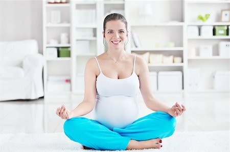 A pregnant young woman in lotus position Stock Photo - Budget Royalty-Free & Subscription, Code: 400-05755712