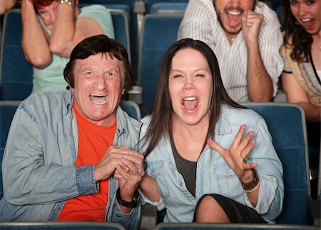 simsearch:400-06138368,k - Scared couple and group of people scream in a theater Fotografie stock - Microstock e Abbonamento, Codice: 400-05755792