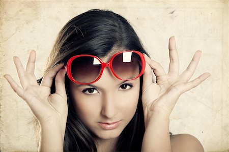 peeping fashion - Portrait of a beautiful young woman wearing sunglasses Stock Photo - Budget Royalty-Free & Subscription, Code: 400-05750462