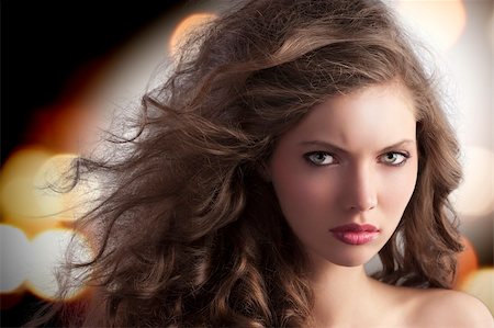 simsearch:400-05744994,k - beauty fashion portrait of a very young alluring brunette with long curly hair with hairstyle flying in the wind Stock Photo - Budget Royalty-Free & Subscription, Code: 400-05750578